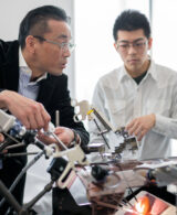 An image of engineering students And Professor working together