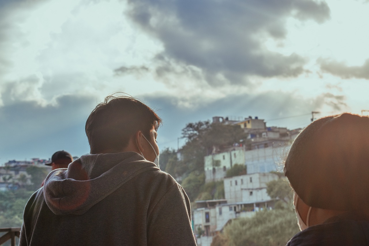 An image of two people with a favela in front of them