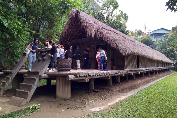 An image of a group of people exploring a hut