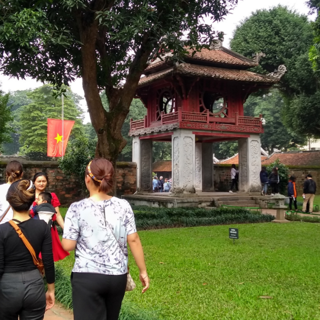 An image of tourists near Vietnam temple