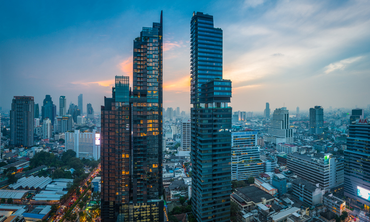 Futuristic skyscraper cityscape at sunset Bangkok highrise tower panorama Thailand
