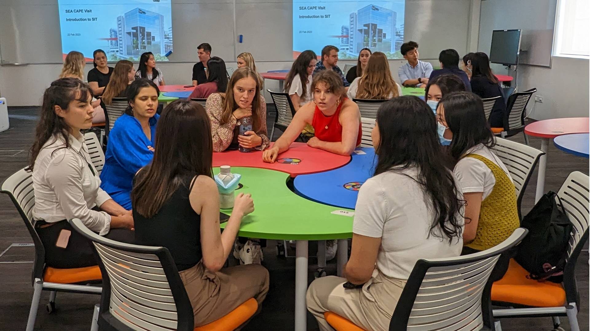 Students and participants interact together at Singapore Institute of Technology.